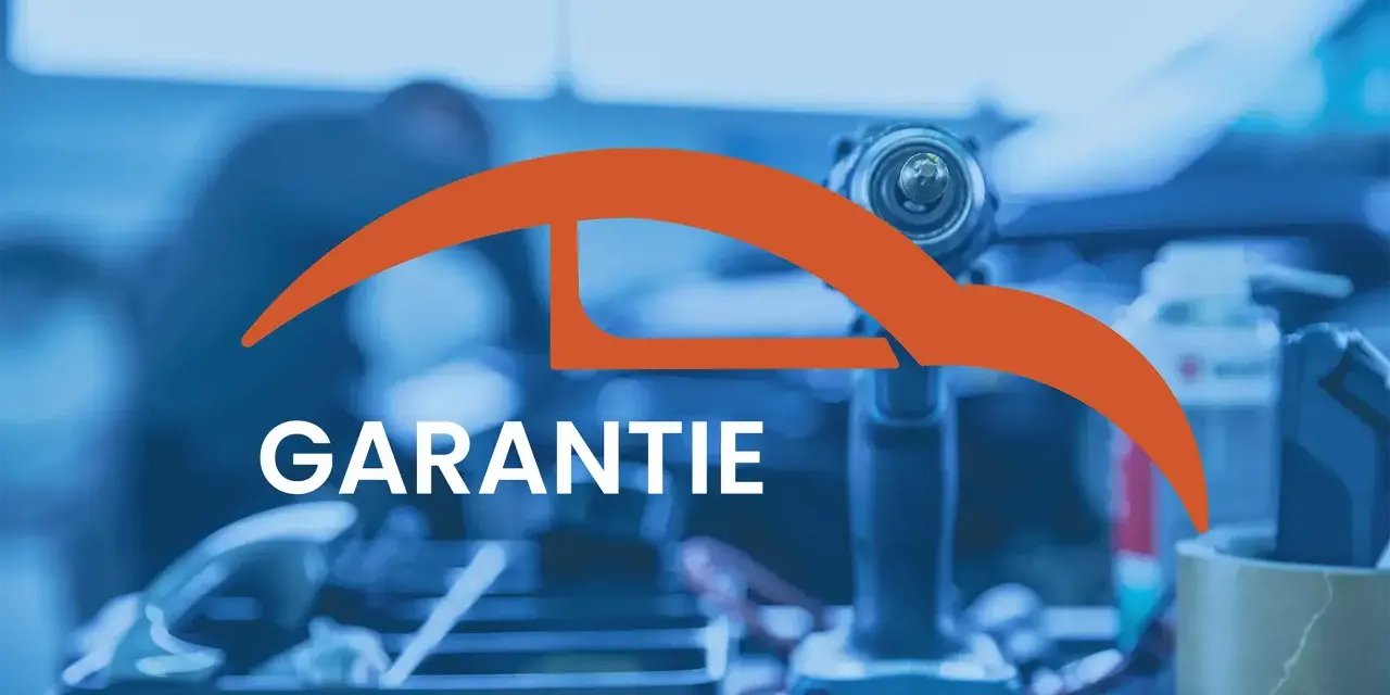 Werkstatt-Szene mit Werkzeug und dem Wort "GARANTIE". Informiert über die Dauer der Garantie auf Reparaturen und Ersatzteile für Autos.