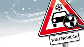 Warnschild mit Schneeflocke und Auto, Lupe zeigt auf Reifen. Darunter steht "WINTERCHECK". Bereiten Sie Ihr Fahrzeug auf den Winter vor!